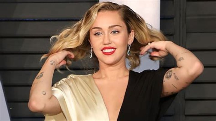 Miley Cyrus Looks Carefree In A Bikini Floating Around Her Pool After VMA Shade